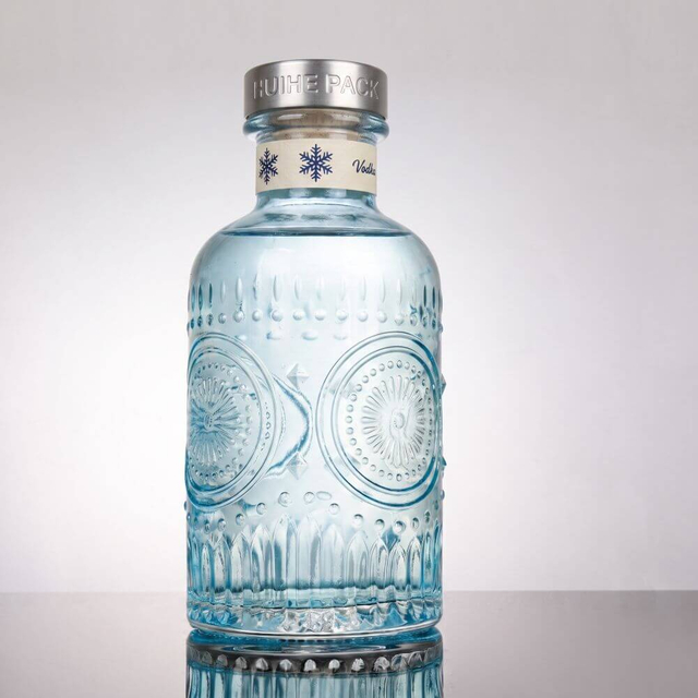 Elaborato floreale - bottiglia di liquore in vetro ispirato con collo spesso